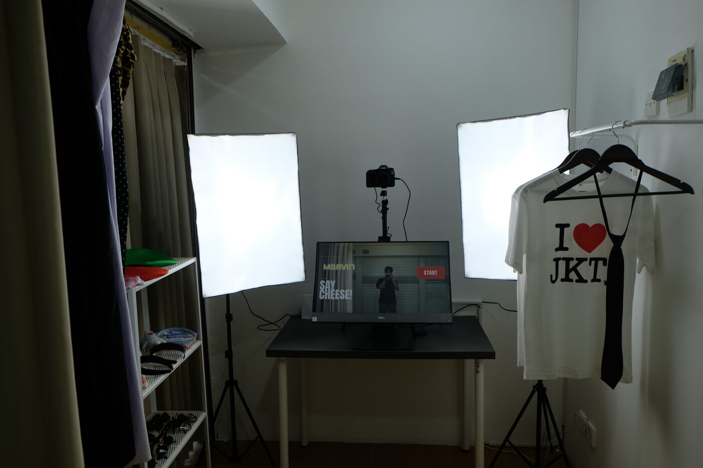The shooting set with studio lights, camera and kiosk